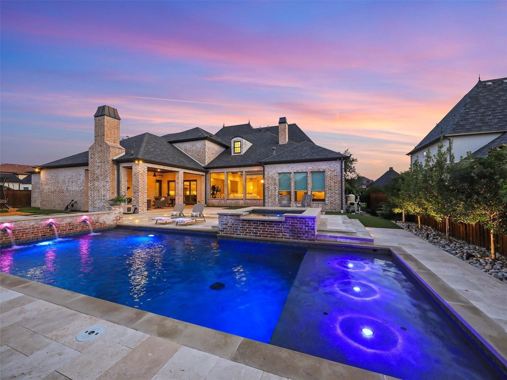 Award-winning custom french manor with front courtyard and stone fireplace in frisco, texas offered at $3 million