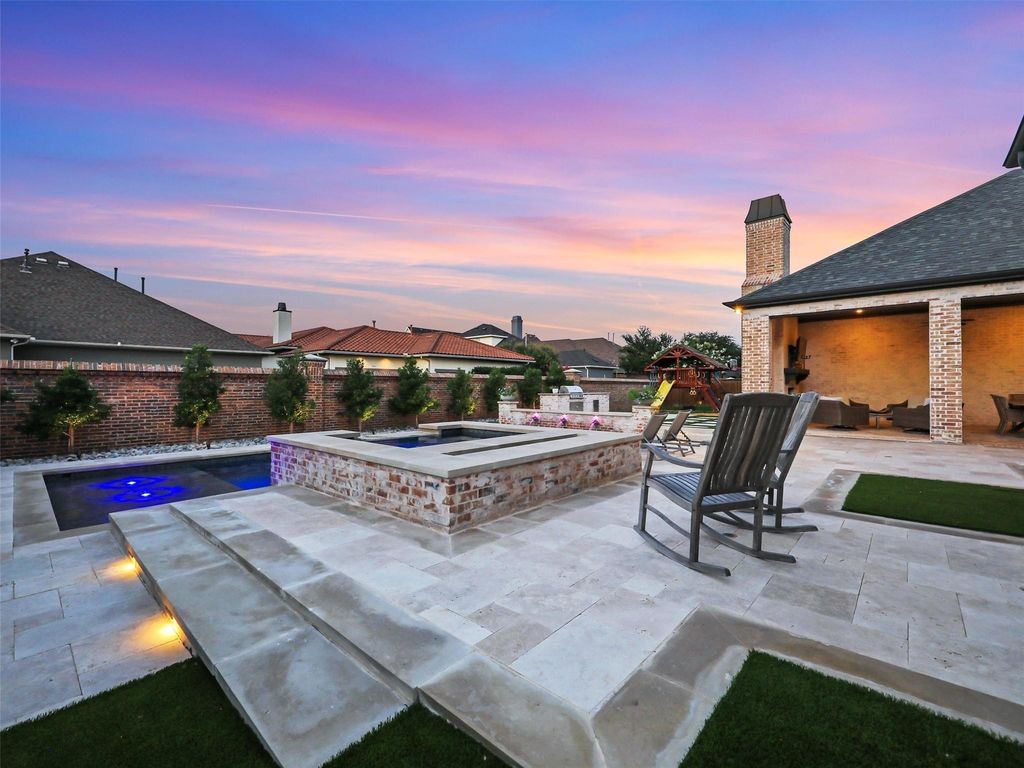 Award-winning custom french manor with front courtyard and stone fireplace in frisco, texas offered at $3 million