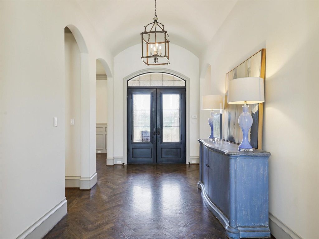Award-winning custom french manor with front courtyard and stone fireplace in frisco, texas offered at $3 million