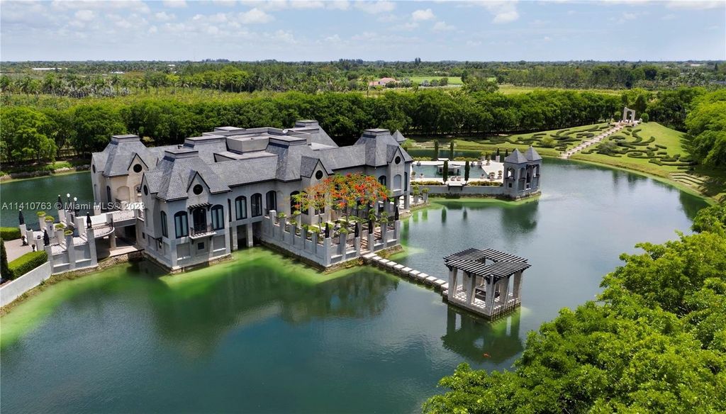 Captivating homestead florida residence a contemporary french chateau reflecting by the lakeshore priced at 21. 8 million 13