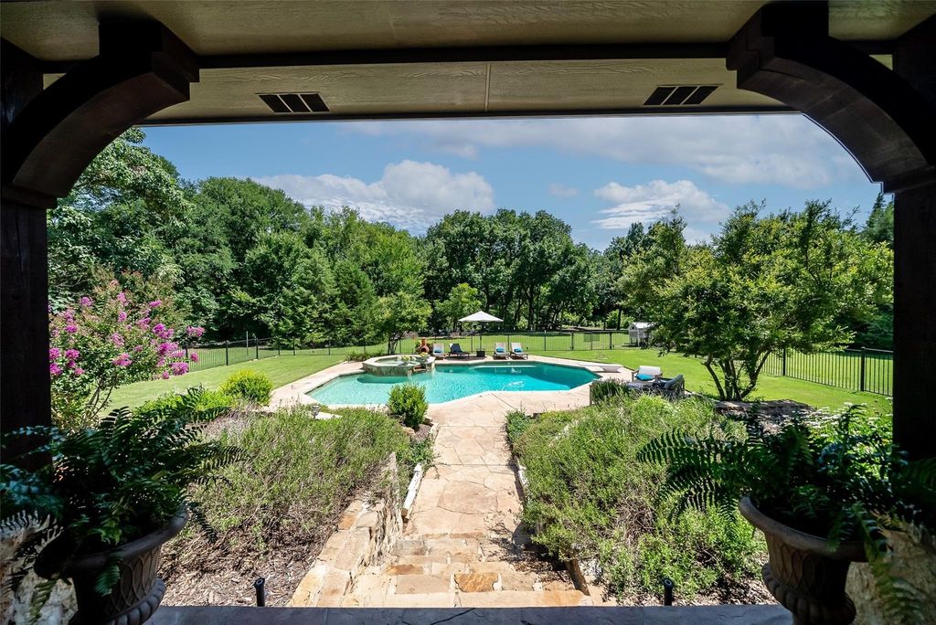Captivating tim jackson-built masterpiece: private oasis with creek views in frisco, texas priced at $2. 35 million