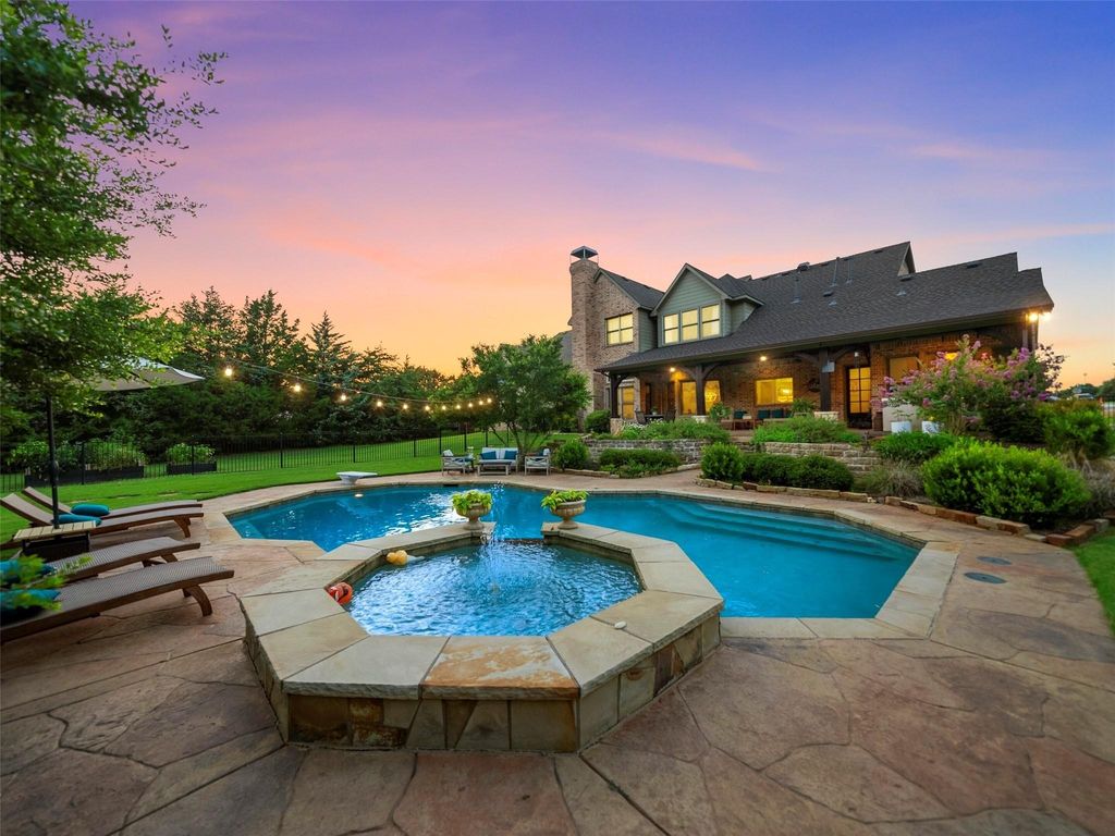 Captivating tim jackson-built masterpiece: private oasis with creek views in frisco, texas priced at $2. 35 million