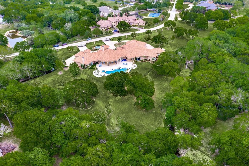 Creek-side retreat: a gem estates in frisco, texas with over 4 acres of natural serenity, priced at $7. 45 million