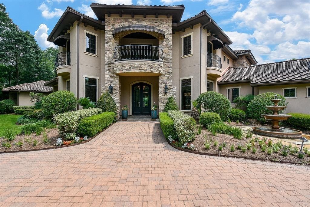 Exquisite living on expansive one acre estate in the woodlands texas ideal for entertaining listed at 2. 975 million 2