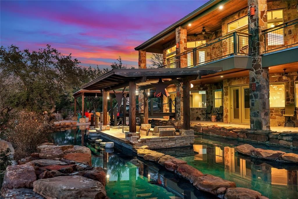Harmonizing tranquil natural beauty with modern luxuries expansive 27 acre spicewood estate listed at 3. 299 million 20