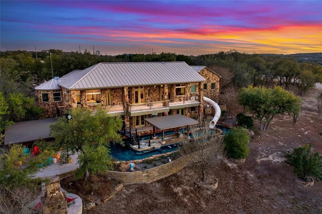 Harmonizing tranquil natural beauty with modern luxuries expansive 27 acre spicewood estate listed at 3. 299 million 33