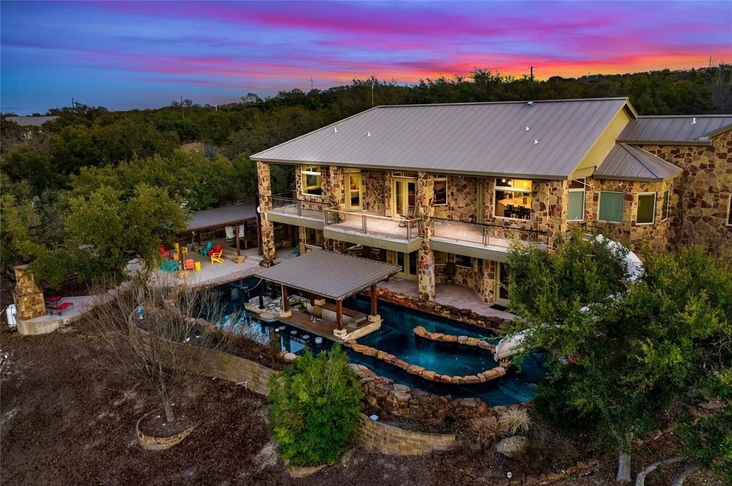 Harmonizing tranquil natural beauty with modern luxuries expansive 27 acre spicewood estate listed at 3. 299 million 36