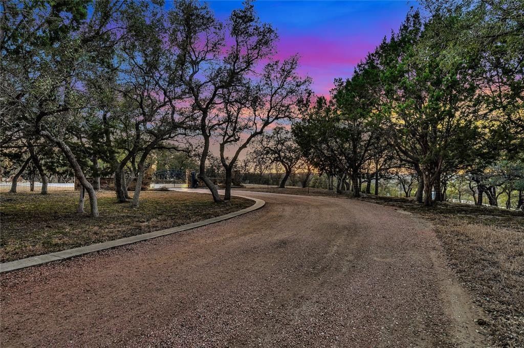 Harmonizing tranquil natural beauty with modern luxuries expansive 27 acre spicewood estate listed at 3. 299 million 39