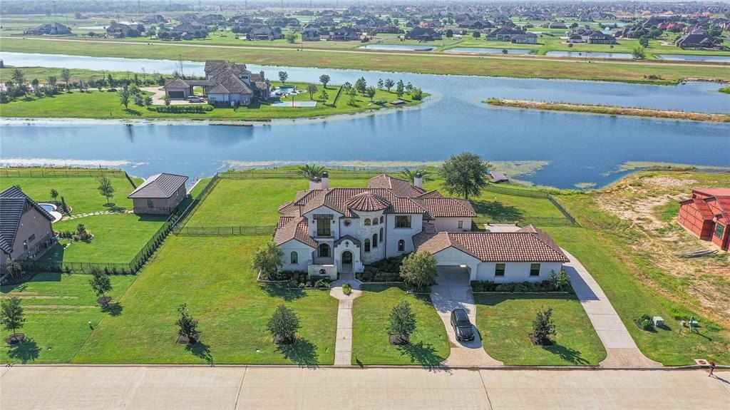 Magnificent residence in prestigious august lakes katy texas your daily getaway in a lavish water sports haven priced at 2. 325 million 2
