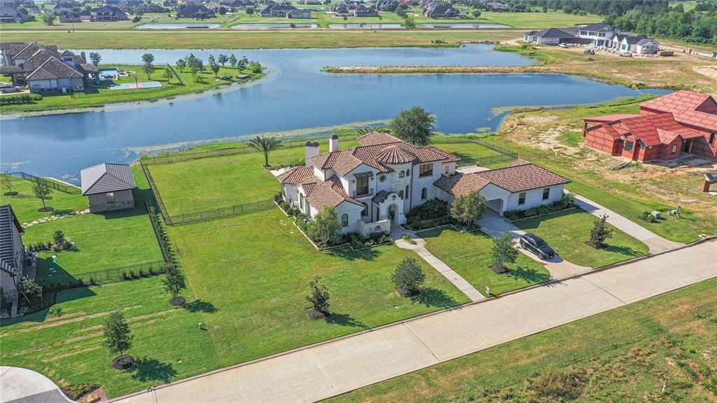 Magnificent residence in prestigious august lakes katy texas your daily getaway in a lavish water sports haven priced at 2. 325 million 50