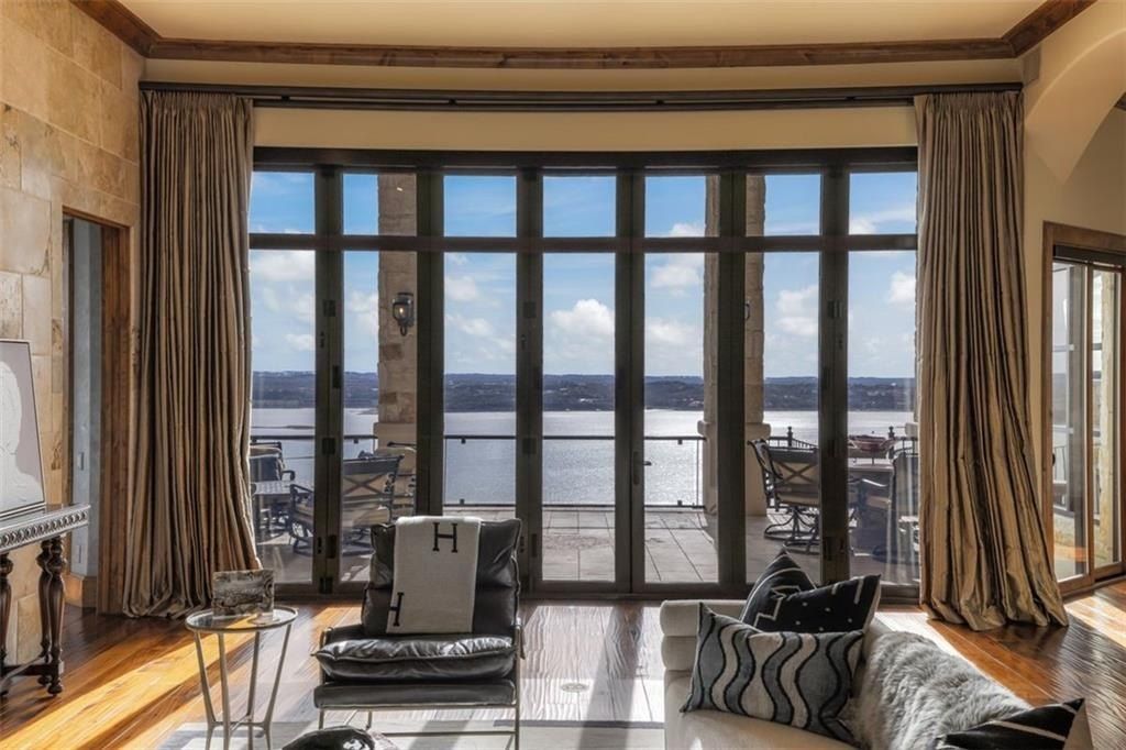 Perched atop lake travis breathtaking water and light vistas define this austin texas home priced at 6. 5 million 9