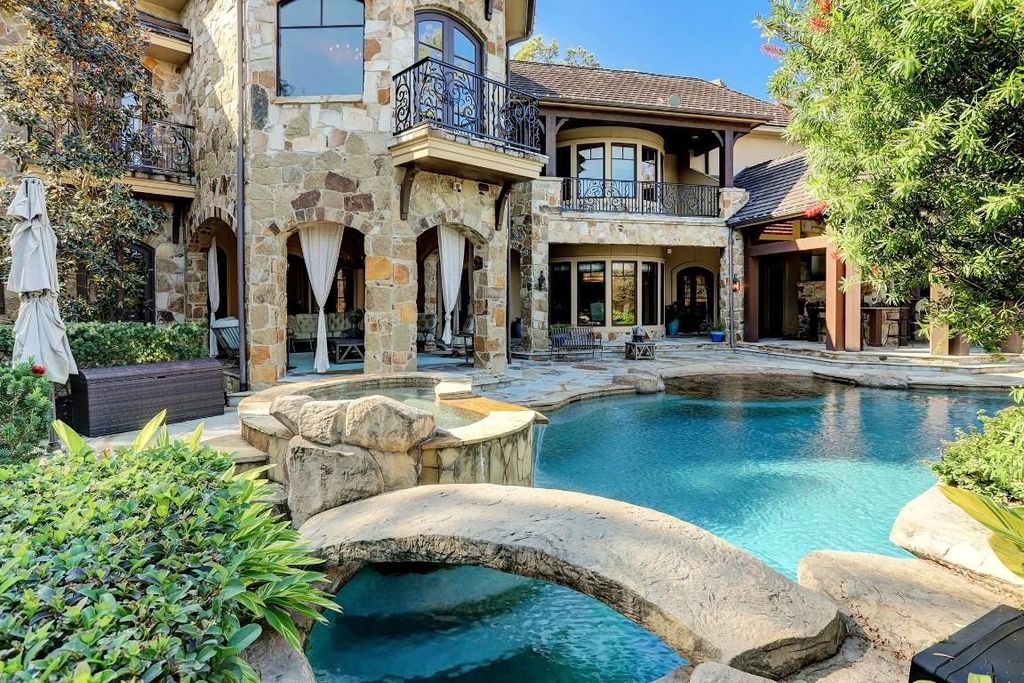 Resort style home showcasing breathtaking views of jack nicklaus signature golf course in the woodlands texas listed for 4. 8 million 48