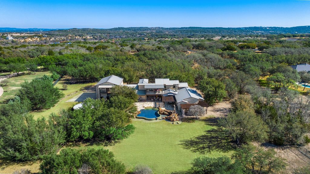 Secluded elegance in spicewood a tranquil haven for elegant living and captivating entertaining listed at 3. 295 million 34