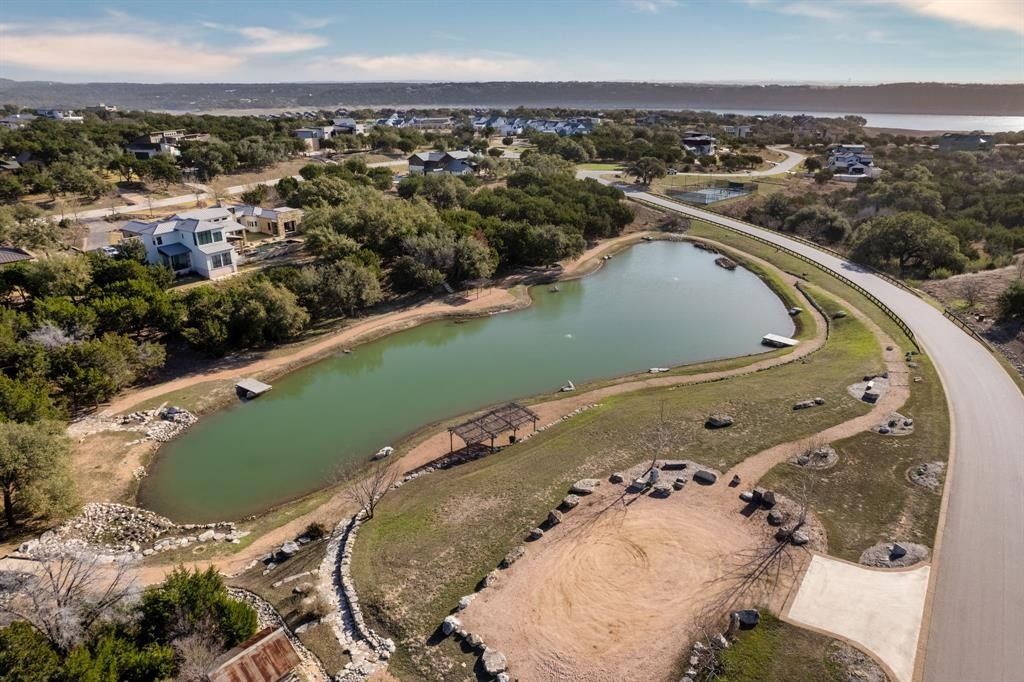 Sumptuous custom home on 1. 5 acres with pond backdrop in the reserve at lake travis priced at 3. 199 million 3