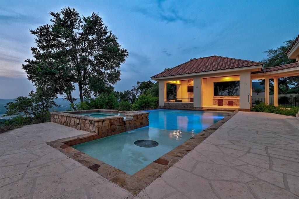 Tranquil lake travis vistas await: custom corner home with majestic views, austin, texas priced at $2. 9 million