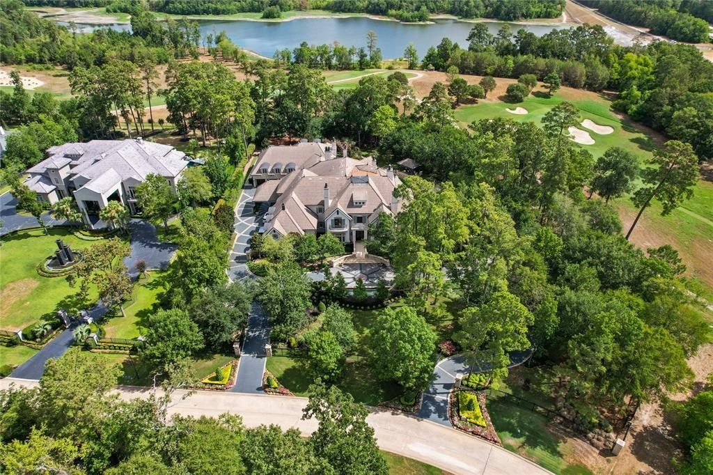 Tranquil oasis resort style pool and lush landscaping offer serenity in the woodlands texas asking for 5. 95 million 1