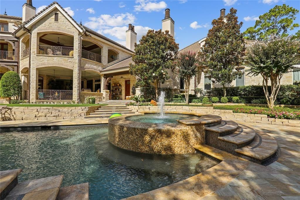 Tranquil oasis resort style pool and lush landscaping offer serenity in the woodlands texas asking for 5. 95 million 15