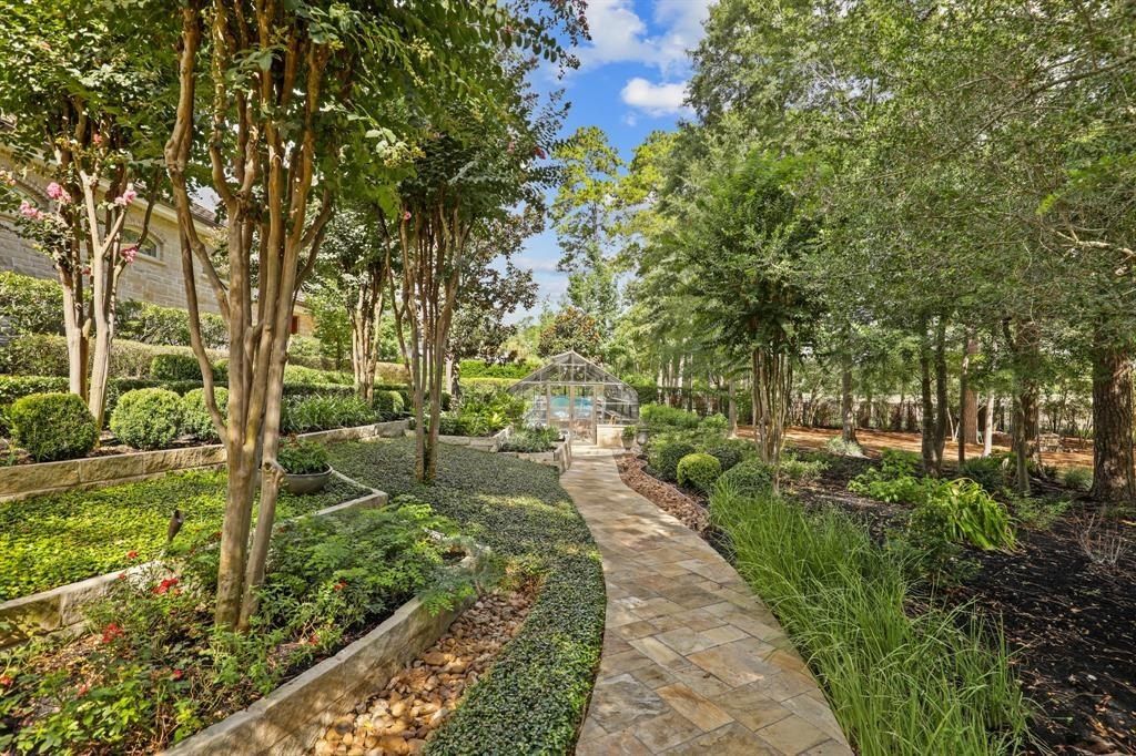 Tranquil oasis resort style pool and lush landscaping offer serenity in the woodlands texas asking for 5. 95 million 17