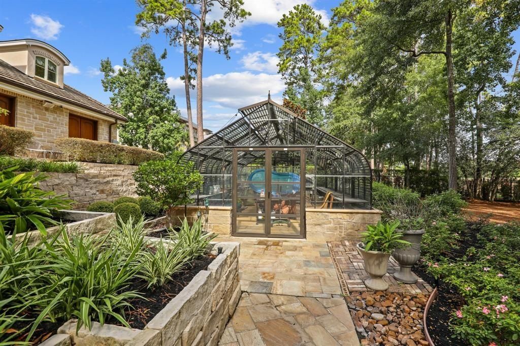 Tranquil oasis resort style pool and lush landscaping offer serenity in the woodlands texas asking for 5. 95 million 19