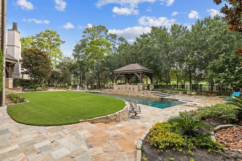 Tranquil oasis resort style pool and lush landscaping offer serenity in the woodlands texas asking for 5. 95 million 20