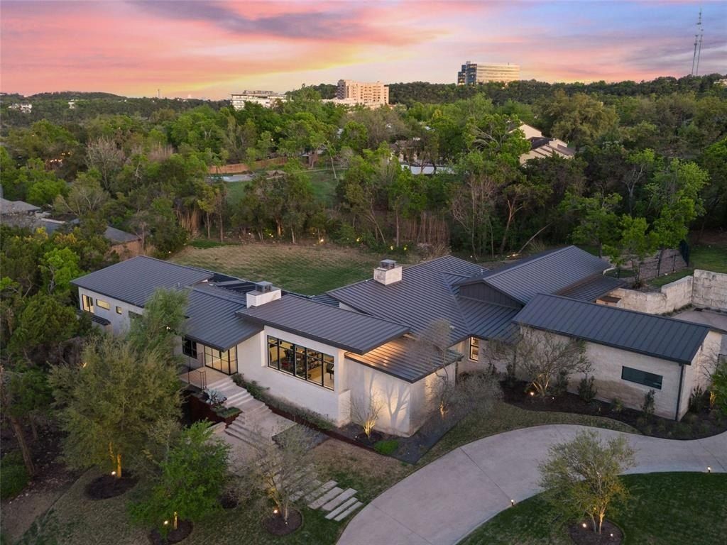 Modern contemporary oasis in austin texas showcases pool and expansive outdoor living space listed at 6. 9 million 7