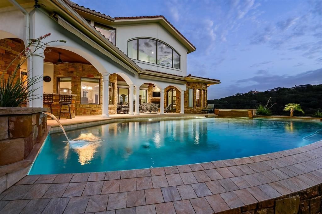 A architectural marvel overlooking lake travis with resort style amenities priced at 3. 1 million 5 result