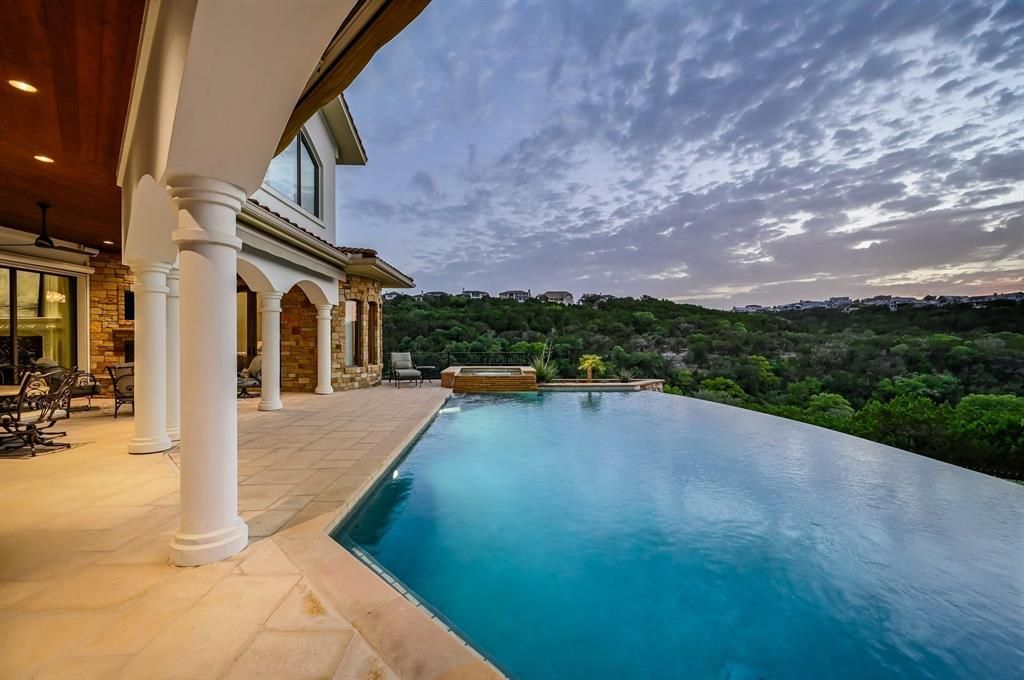 A architectural marvel overlooking lake travis with resort style amenities priced at 3. 1 million 6 result