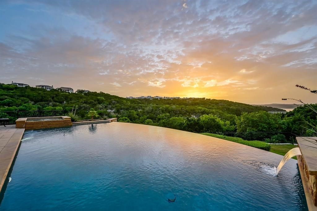 A architectural marvel overlooking lake travis with resort style amenities priced at 3. 1 million 7 result