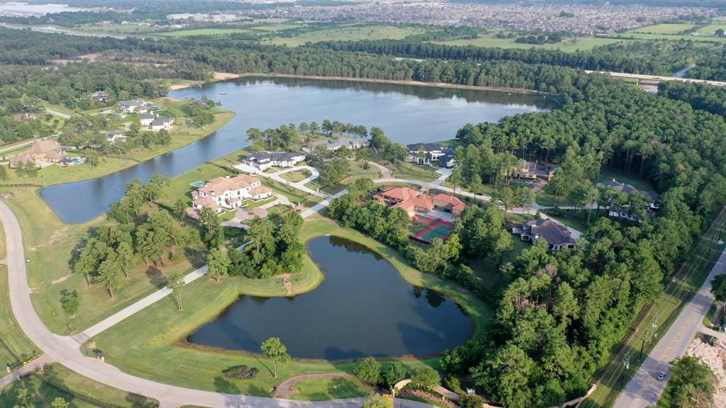 Secluded splendor in tomball grand masterpiece on a lakefront corner lot for 3. 395 million 50