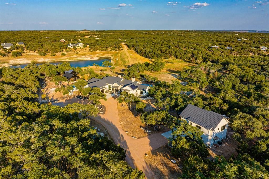 Serene lake views and luxury living await in wimberleys exclusive property priced at 3. 995 million 3