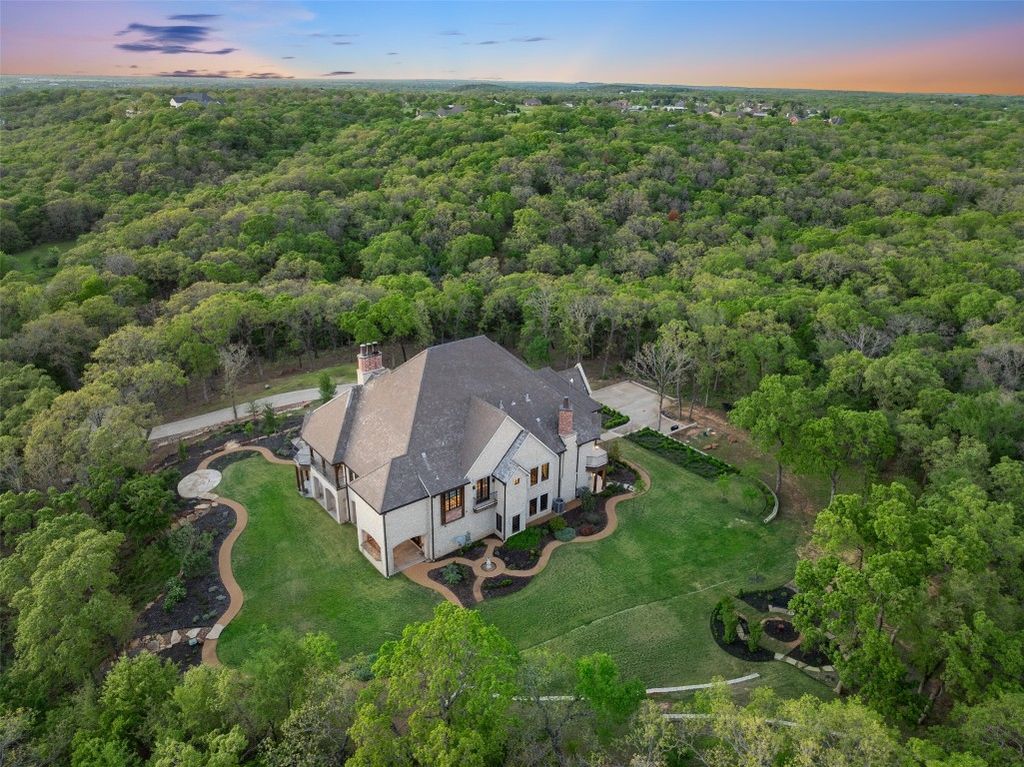 Secluded splendor luxurious retreat nestled on 34 wooded acres only an hour north of dallas offered at 5. 7 million 40