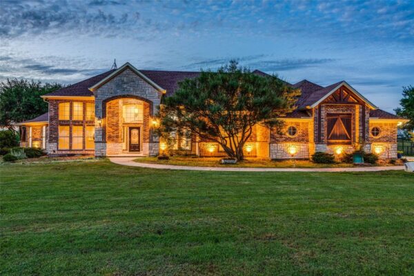 Stunning Ranch Retreat: Luxury Living Amidst Serene Pastures and Pristine Equestrian Facilities Asks for $2.45 Million