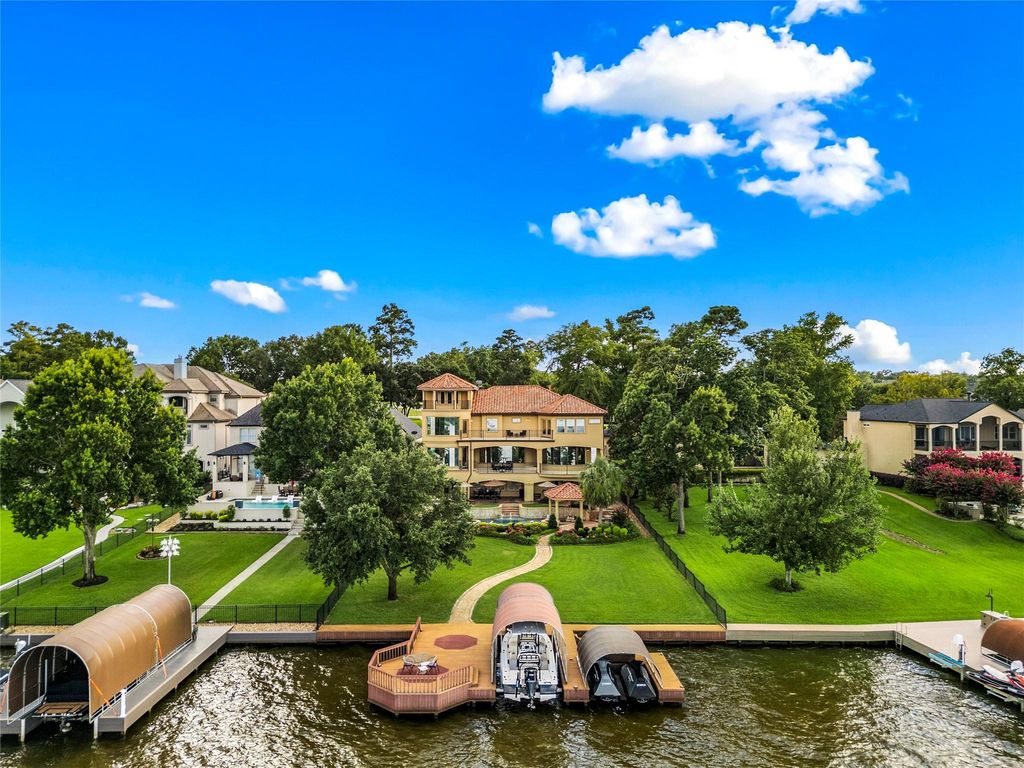 Elegant lakefront living discover this exquisite 4 story estate on lake conroe priced at 3195000 5