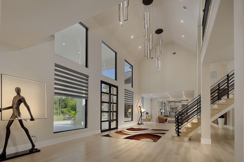 Contemporary luxury redefined this stunning residence with east and west wings is listed for 4 4