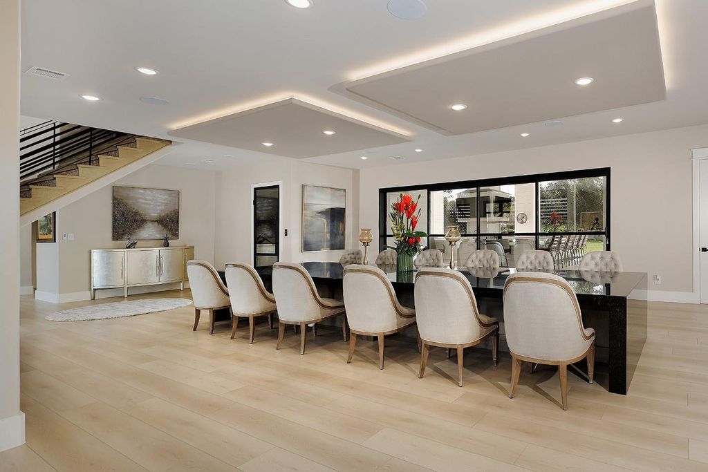 Contemporary luxury redefined this stunning residence with east and west wings is listed for 4 8