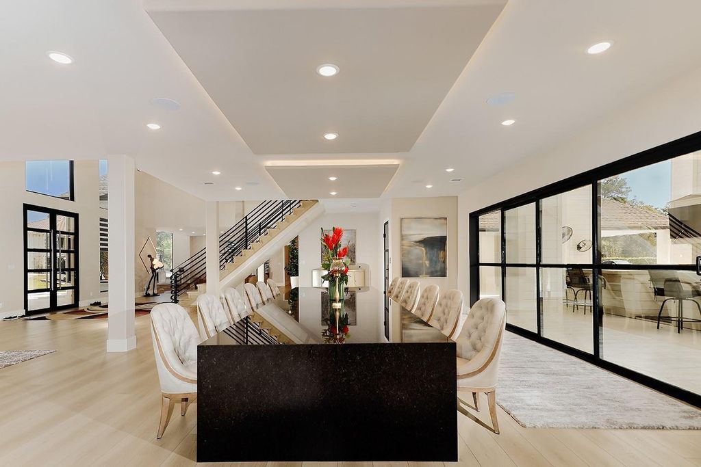 Contemporary luxury redefined this stunning residence with east and west wings is listed for 4 9