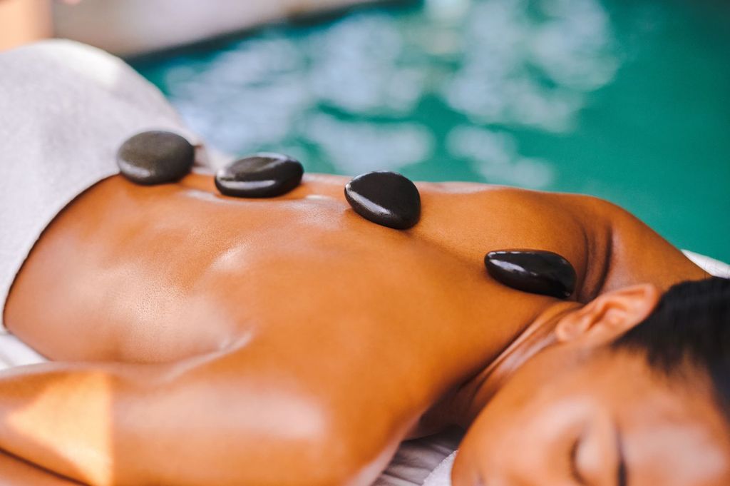 Hot stone massage gettyimages 1372664129 fecefea5f71c44f7aaeaf4ae5dbfcbe4 compressed result